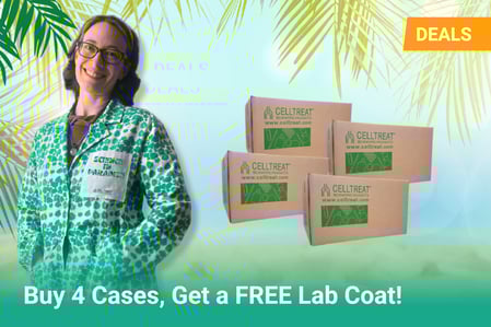 A cheerful woman wearing a green and white tropical-themed lab coat with a patch that says "SCIENCE IN PARADISE" stands smiling on the left. On the right, four cardboard boxes labeled "CELLTREAT Scientific Products" are stacked. Palm fronds frame the image from above. A bright orange "DEALS" label is in the top right corner, and a banner at the bottom reads, "Buy 4 Cases, Get a FREE Lab Coat!"