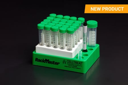  CELLTREAT RackMaster rack system displaying multiple conical tubes with green caps, a white labeling area, and a CELLTREAT branded marker. The rack is designed for efficient tube organization, with clearly marked graduations for precise measurements. A bright "NEW PRODUCT" label is positioned in the top right corner, highlighting its recent launch.