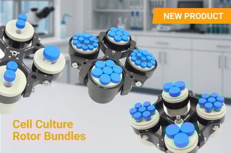 “Promotional image showcasing OHAUS Cell Culture Rotor Bundles for Frontier Centrifuges, featuring multiple rotors loaded with blue-capped lab tubes in a clean laboratory setting. A bright orange label reads ‘NEW PRODUCT’ and bold text below says ‘Cell Culture Rotor Bundles.’