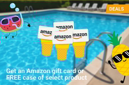 A bright, fun summer-themed promotional image featuring an outdoor swimming pool with lounge chairs in the background. In the foreground, animated characters of a pineapple and a watermelon with sunglasses and smiling faces flank a stack of Amazon gift cards popping out of yellow ice cream cones. An orange "DEALS" banner is in the top right corner. Text at the bottom reads: “Get an Amazon gift card or FREE case of select product.”