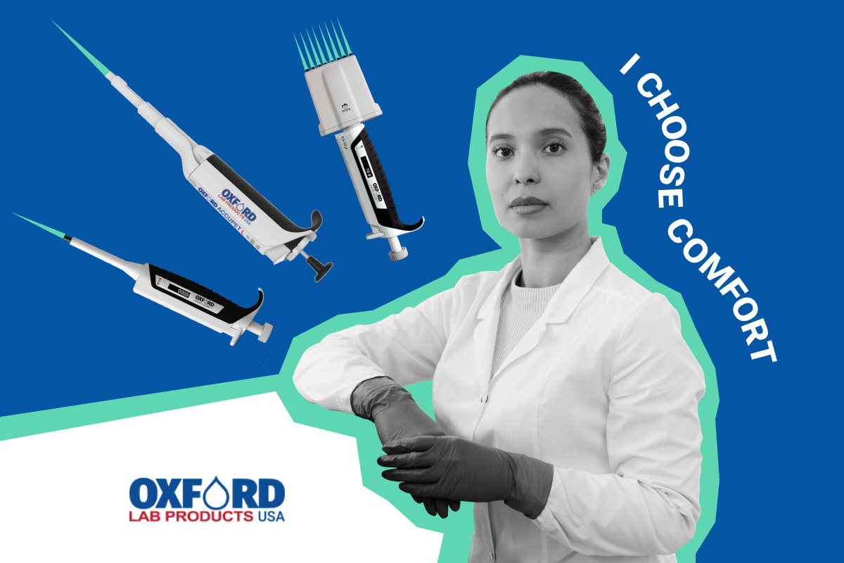 Female lab technician in a lab coat and gloves standing confidently next to Oxford Lab Products ergonomic pipettes with the slogan “I Choose Comfort”