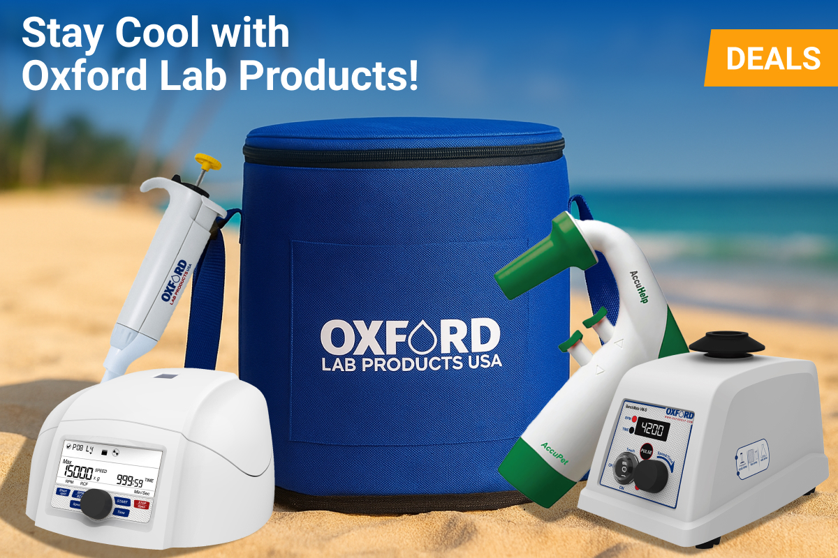 A summer-themed promotional image featuring various Oxford Lab Products on a sandy beach. A large, blue Oxford Lab cooler bag is in the center, surrounded by a white centrifuge, a pipette, a green and white pipette controller, and a vortex mixer. Text on the image reads ‘Stay Cool with Oxford Lab Products’ and a yellow banner says ‘DEALS.’